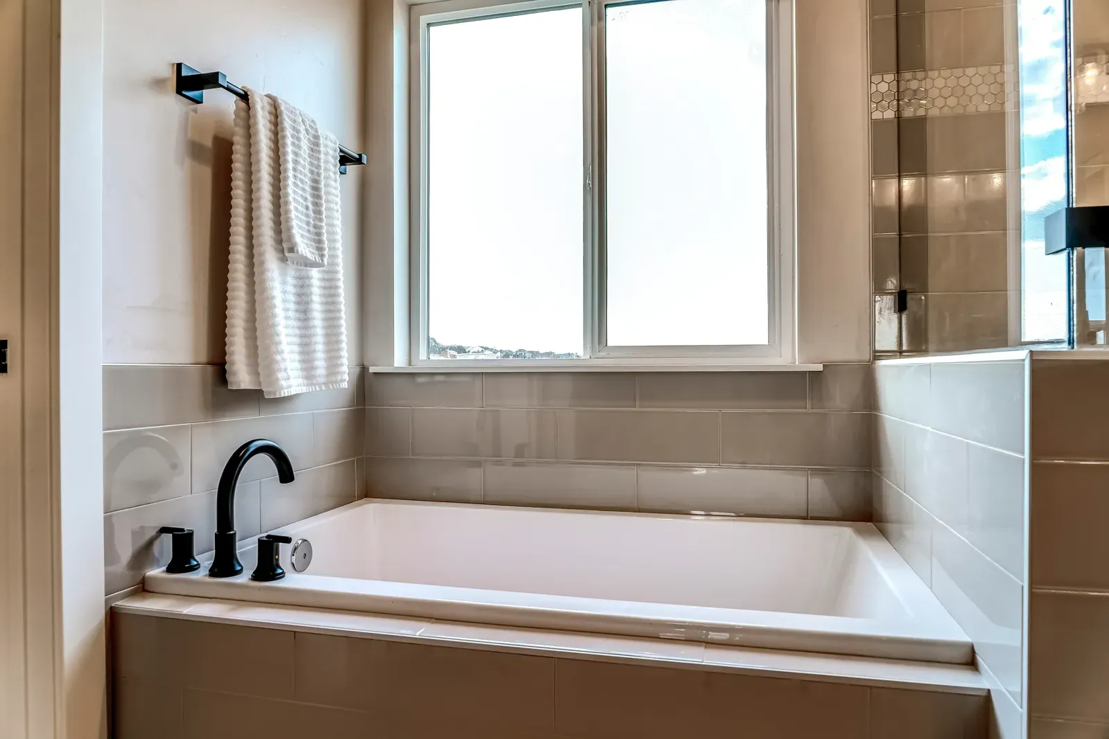 An unprocessed bathtub in a bathroom. | WP Bathroom Remodeling